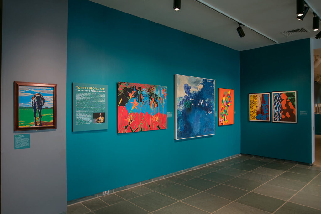 The Forman Gallery at MAG, with art by G. Peter Jemison on the walls.