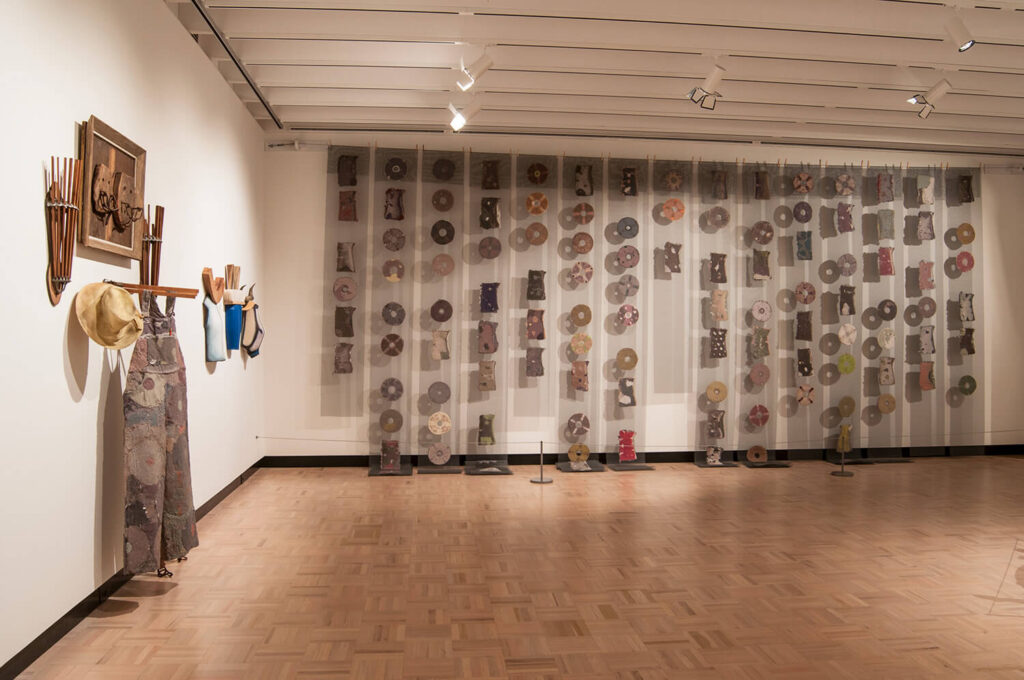 Nancy Jurs's ceramic artwork hanging on the walls of MAG's Docent Gallery.