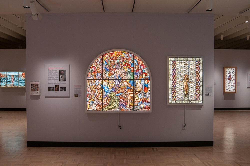 Two large stained glass windows on view in the "Path to Paradise" exhibition.