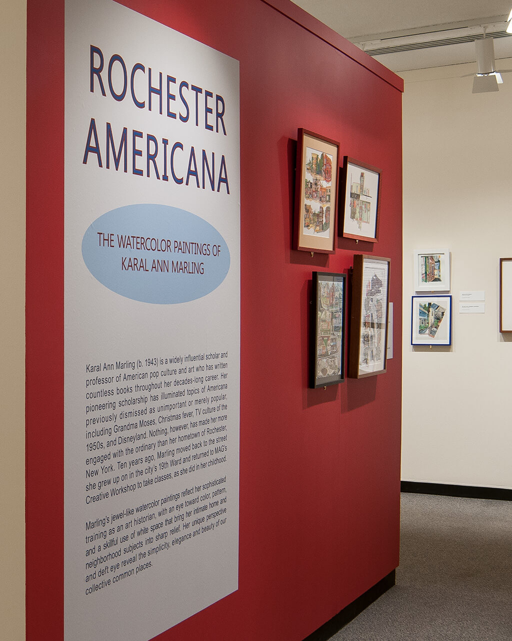 "Rochester Americana" installed in the Lockhart Gallery. The title wall is a cherry red.