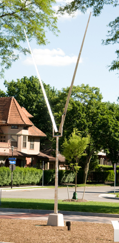 Sculpture like a shiny antenna, rotating and moving with air currents