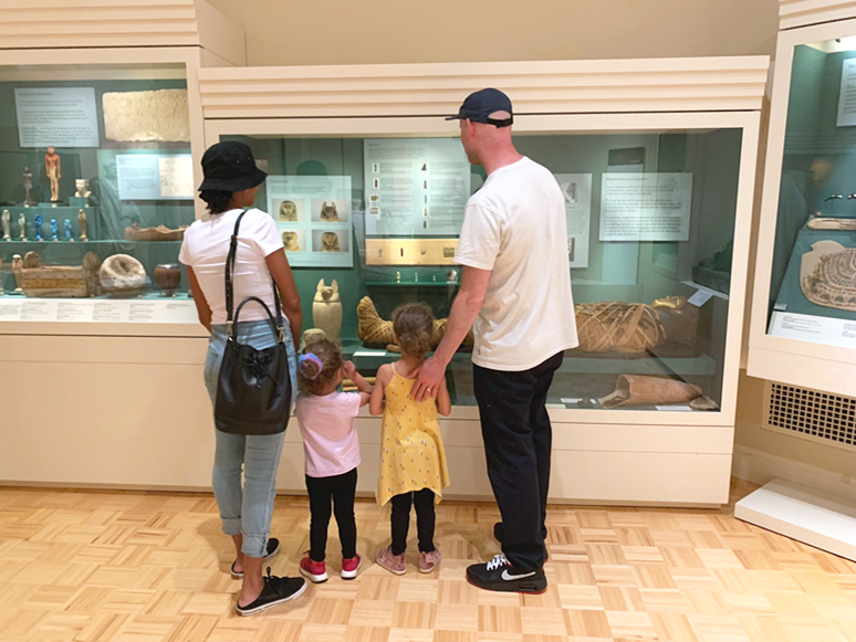 A family looking at MAG's ancient galleries