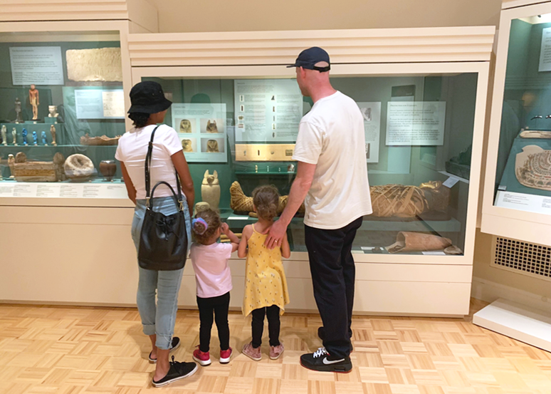 A family looking at MAG's ancient galleries.