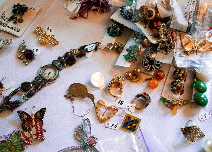 A wide range of jewelry labeled for sale.