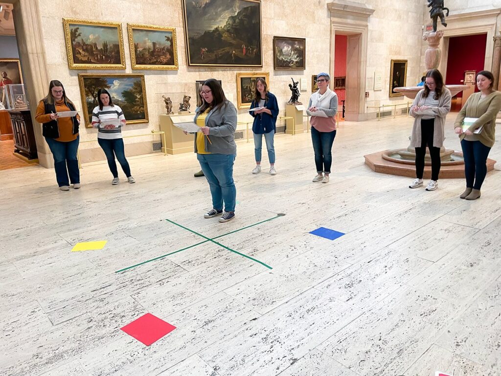 Teachers doing an activity in the Fountain Court.