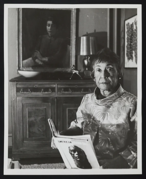 Alma Thomas with her portrait by Laura Wheeler Waring, Portrait of a Lady (1947, SAAM) in her home, Washington, DC, 1968.