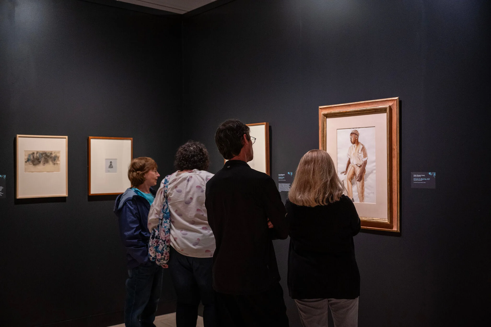 Guests looking at drawings on the walls in Drawing as Discovery.