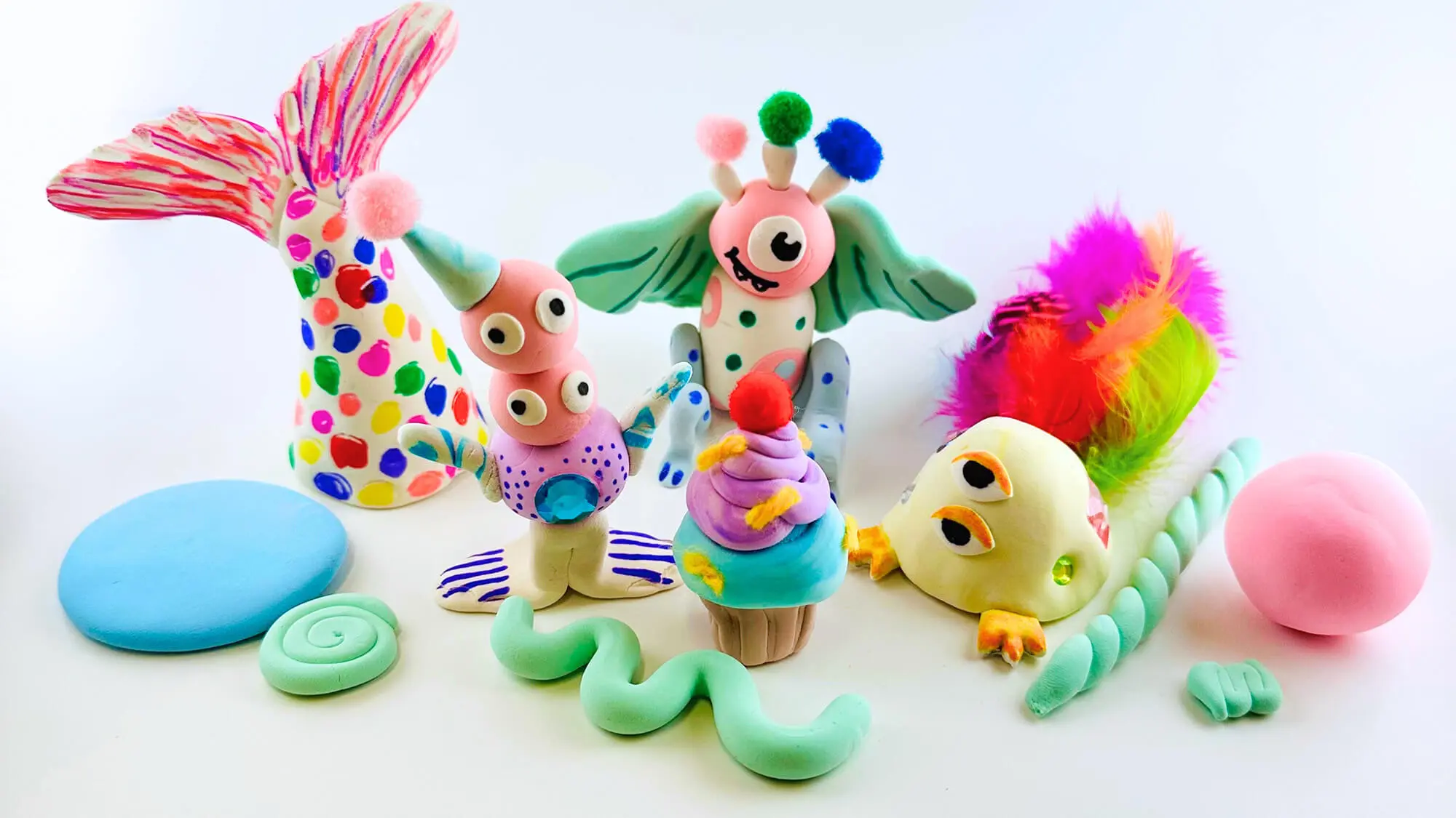 Monster figures made out of colorful clay.