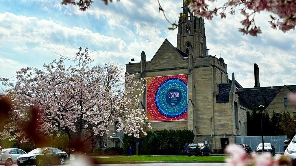 Cutler Union with an Alma Thomas banner on the side, trees flowering.