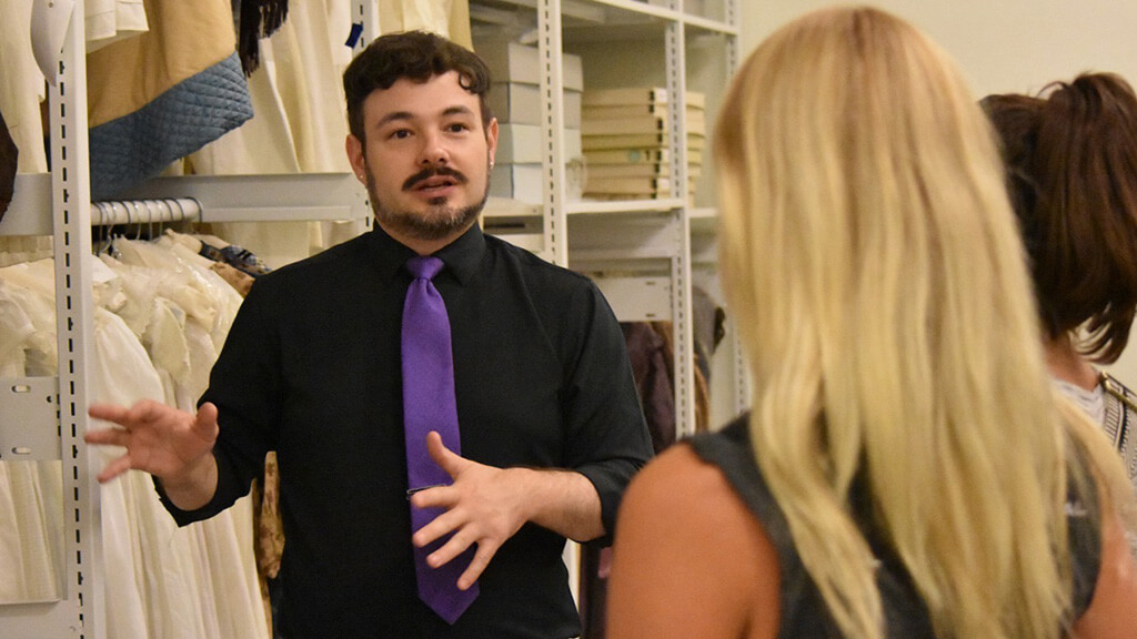 Curator Brandon Brooks giving a tour in the textile vault at Genesee Country Village & Museum.