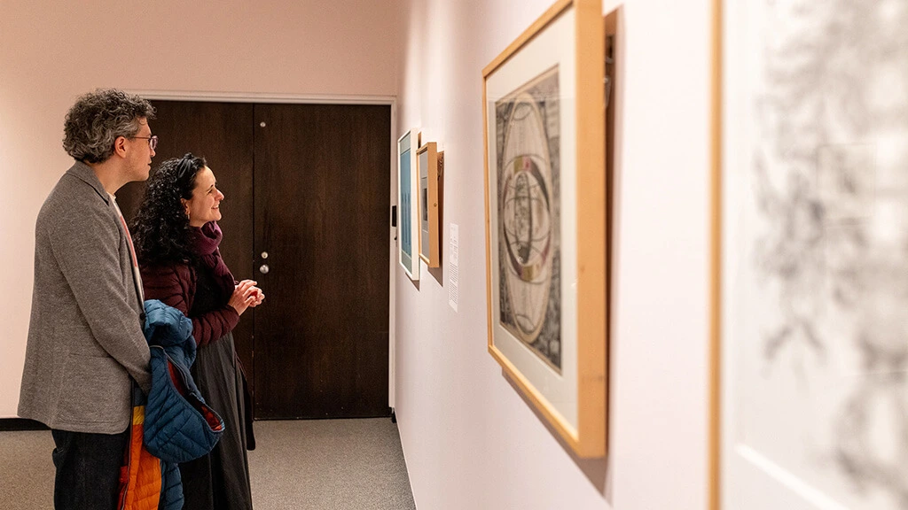 Two visitors in the Making Connections exhibition at MAG.