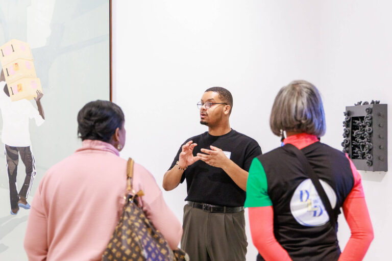 A tour guide giving a tour in MAG's Contemporary art galleries.