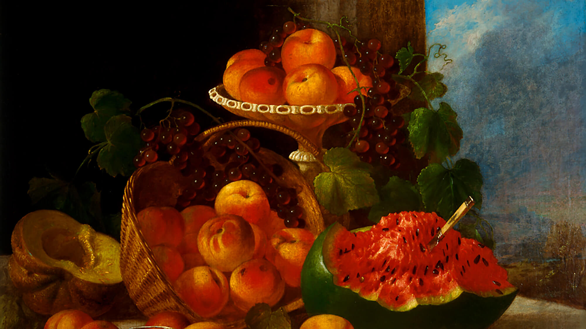 An oil painting of a table set with a platter and wicker basket of peaches and a watermelon that's been cut open.