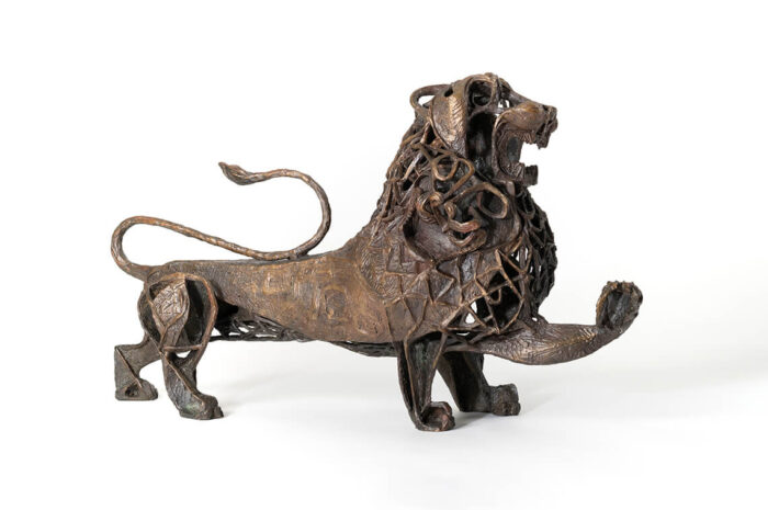 An abstract bronze sculpture of a lion.