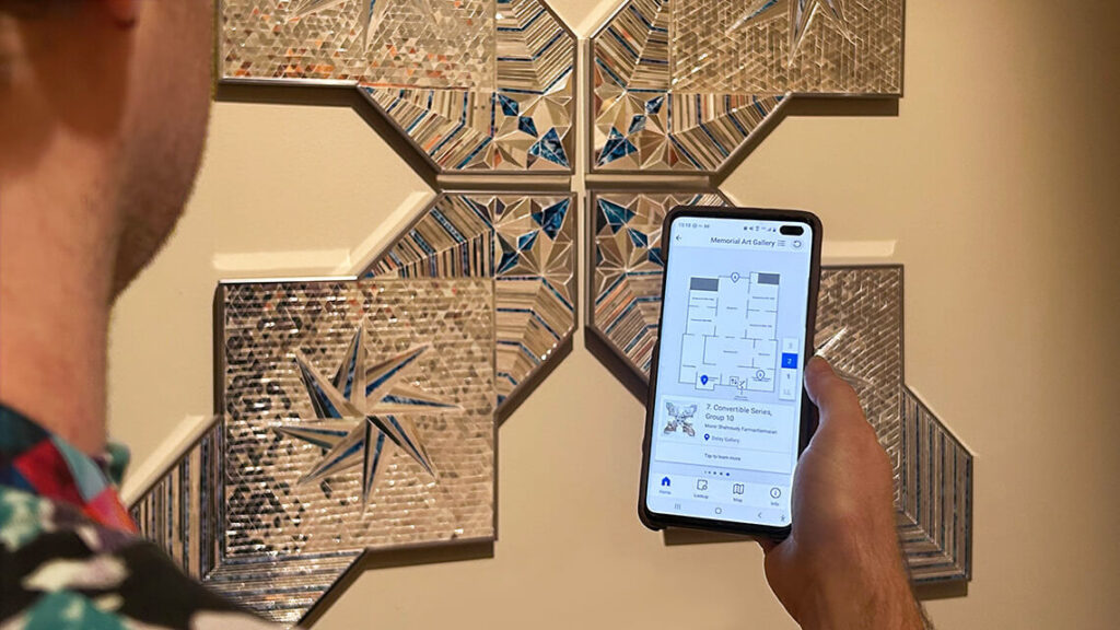 A person with the digital guide's map open on their phone.