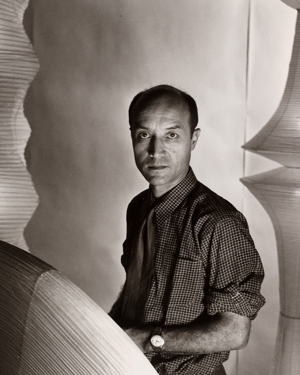 Black and white photograph of Isamu Noguchi.