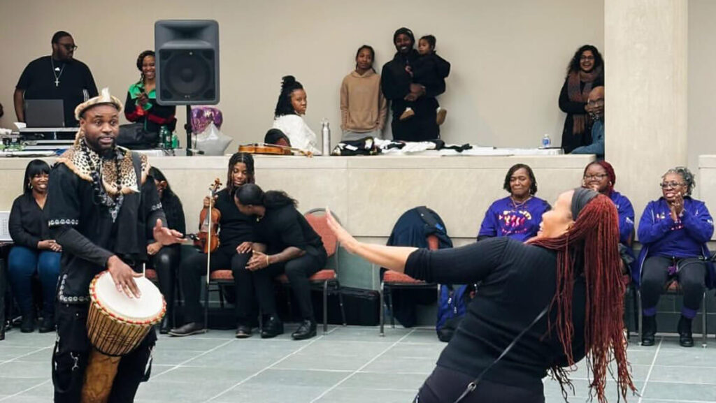 A musician and a dancer at a previous Black History Month Celebration Day.