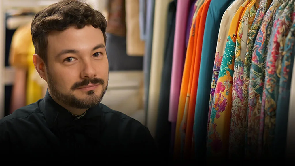 Brandon Brooks with racks of clothing in the background.