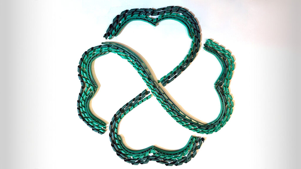 A four-leaf clover made out of curls of green paper.