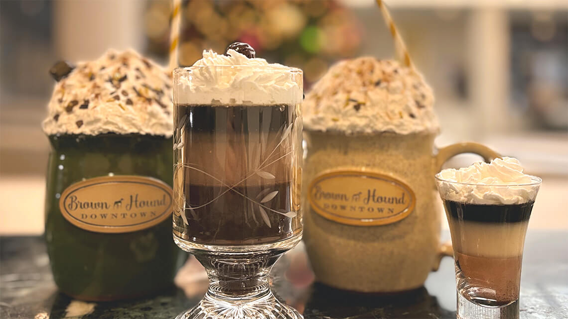 Hot chocolate drinks in Brown Hound Downtown mugs.