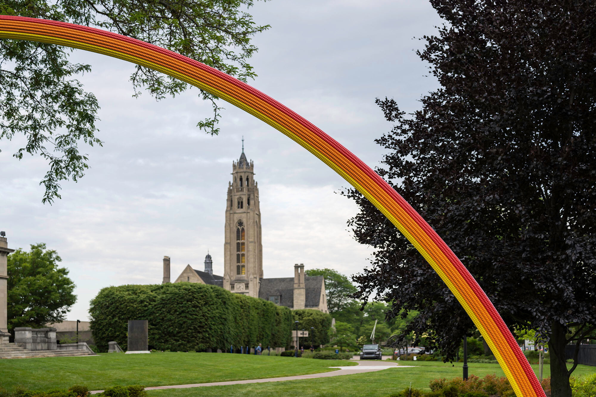 MAG's Cutler Union in the background, framed by the arch of Pia Camil's "Lover's Rainbow" in the foreground.