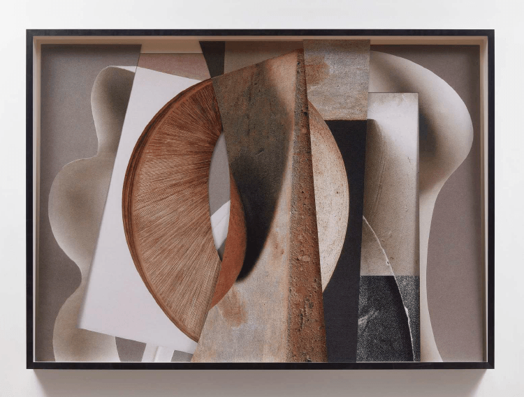 Photograph of a large-scale shadow box filled with scanned images from art publications and vintage magazines.