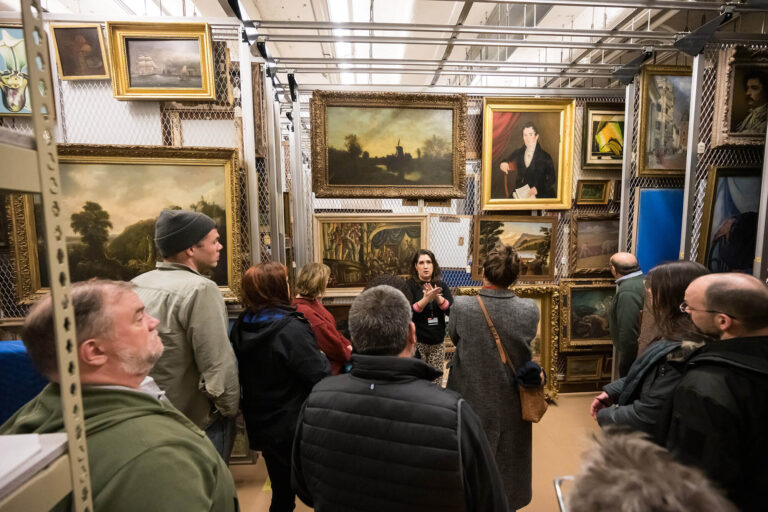 Curatorial assistant Lauren Tagliaferro gives a tour of MAG's painting storage.