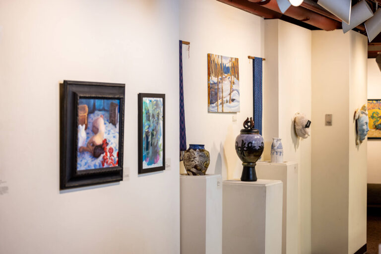 Works of art hung on the wall in the Lucy Burne Gallery.