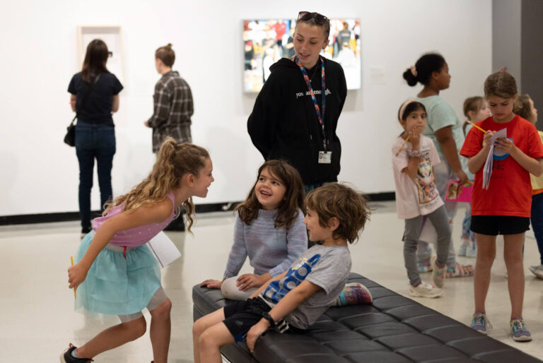 A Creative Workshop instructor overseeing kids having fun in the galleries.