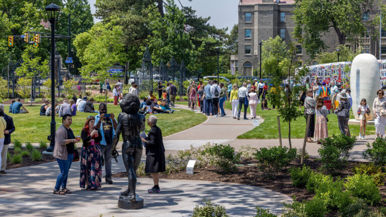 People exploring MAG'c Centennial Sculpture Park.