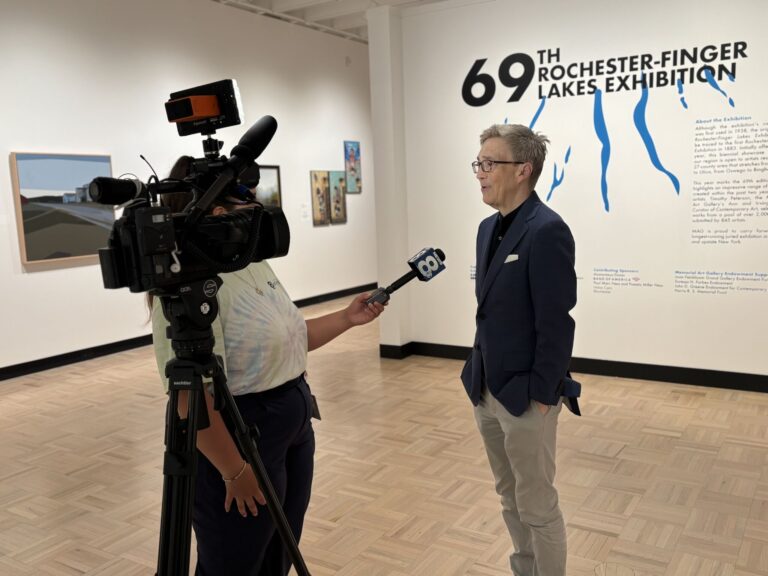 A press team interviewing one of MAG's curators.