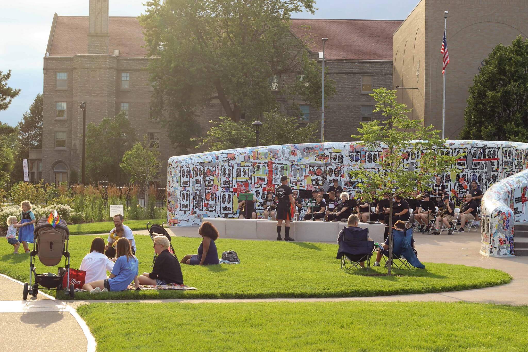 Visitors sitting outside in the Centennial Sculpture Park.