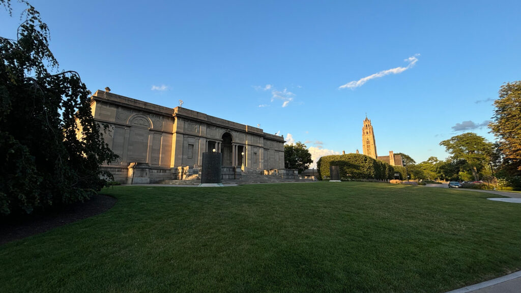 MAG's 1913 museum building in early sunset, the tower of Cutler Union in the background.