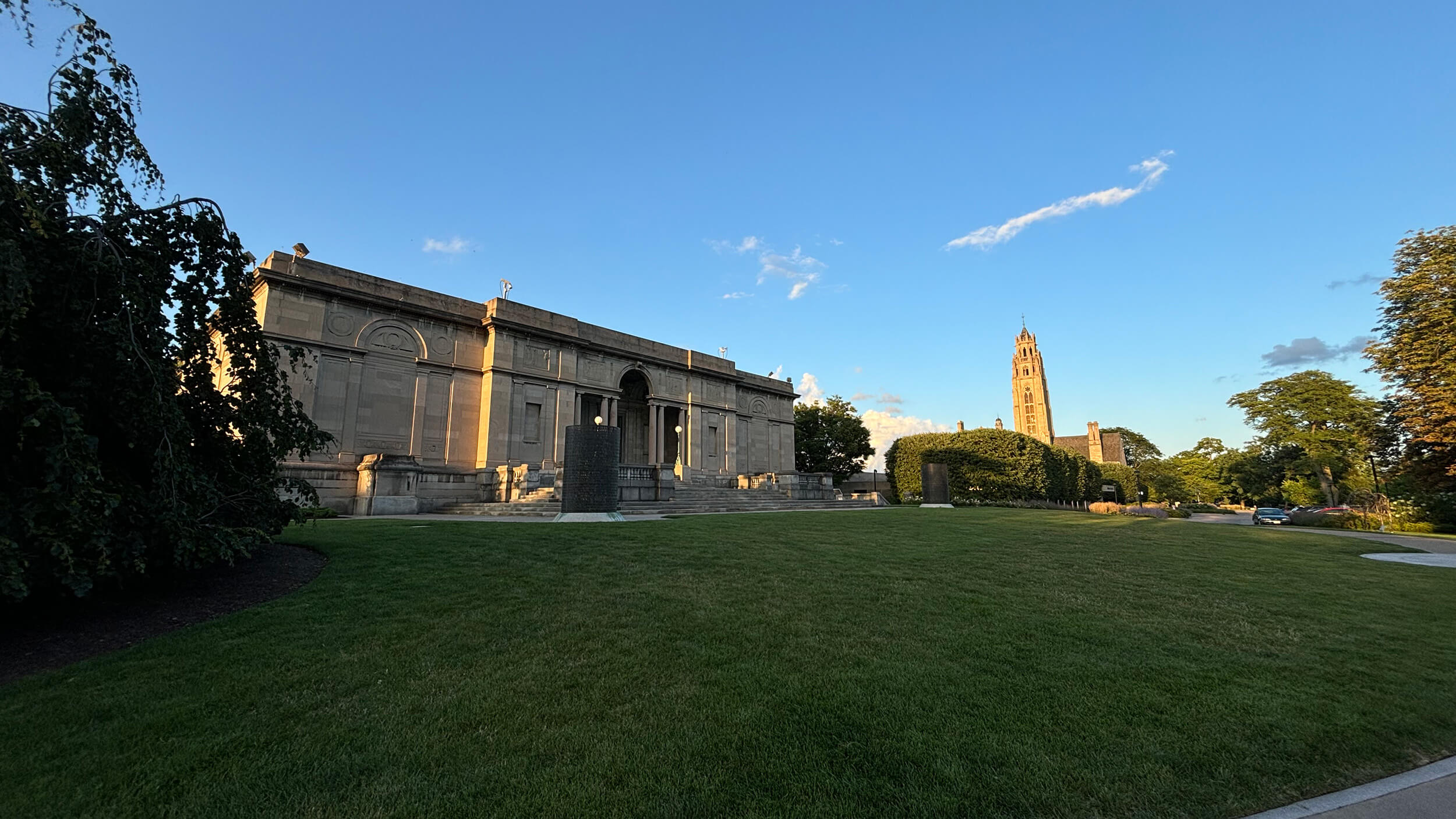 MAG's 1913 museum building in early sunset, the tower of Cutler Union in the background.
