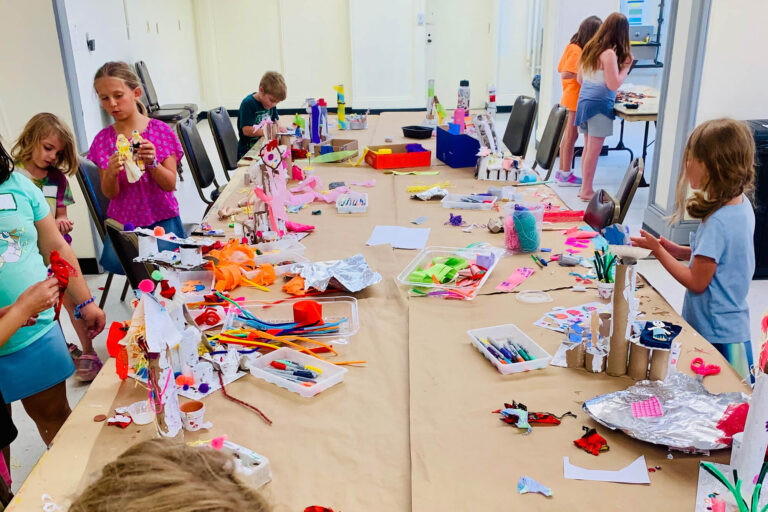 Kids having fun making art in the Creative Workshop.