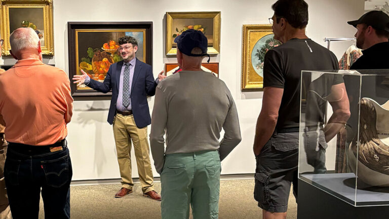 Brandon Brooks leads a tour in MAG's galleries.