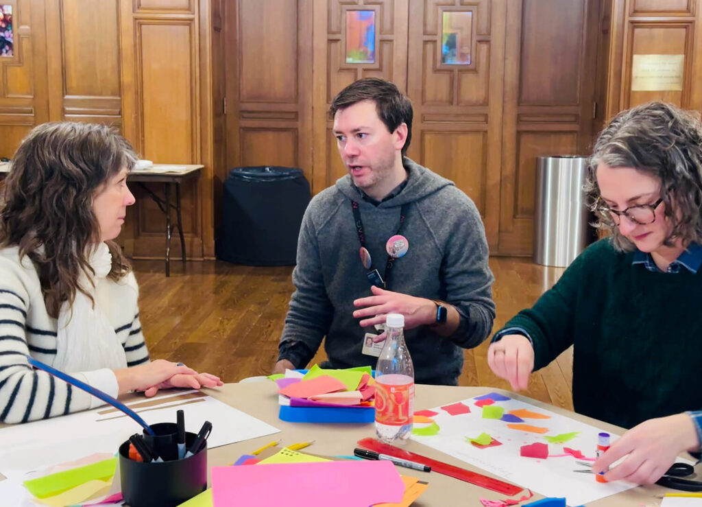 A MAG museum educator talks with teachers in a professional development workshop.