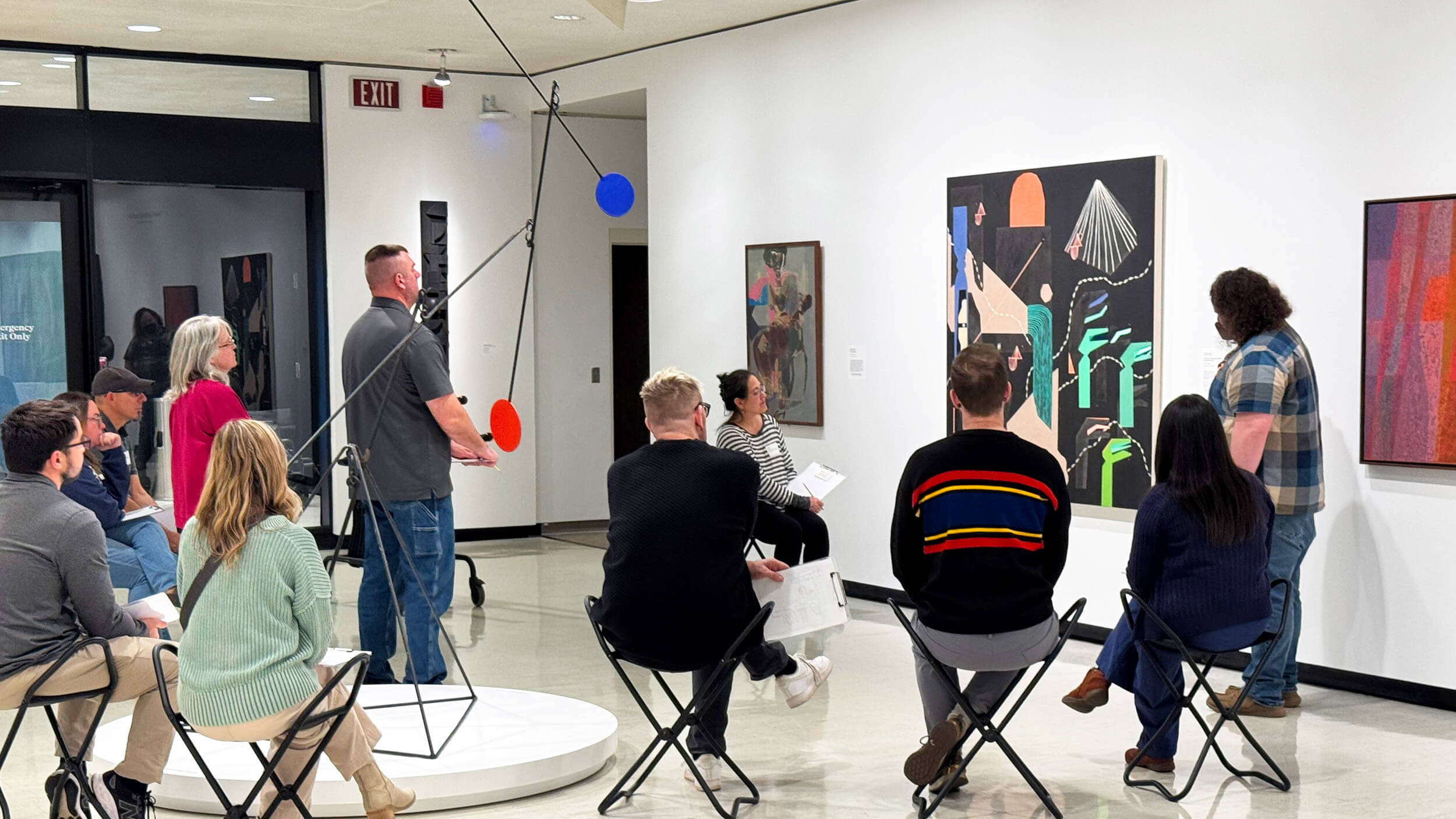 A museum educator leading a teacher workshop in the Contemporary Art galleries.
