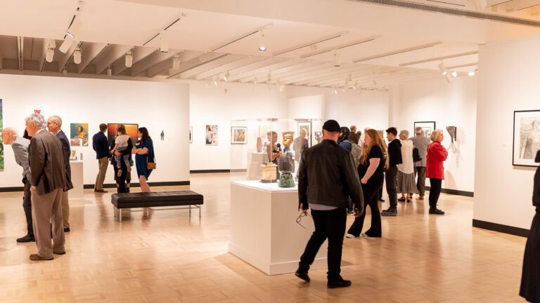 Visitors explore artwork in MAG's Docent Gallery.