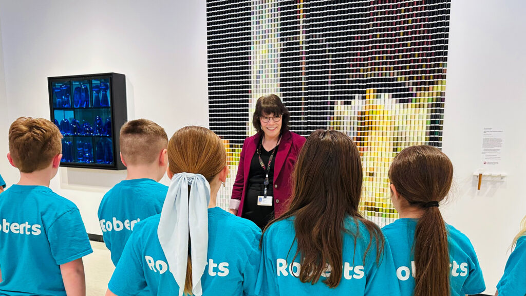 A docent giving a school tour in the Contemporary art galleries at MAG.