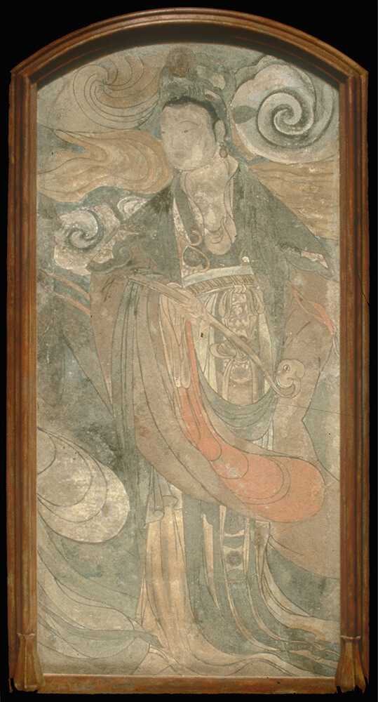 A woman in Ming Dynasty clothing holding a back-scratcher.