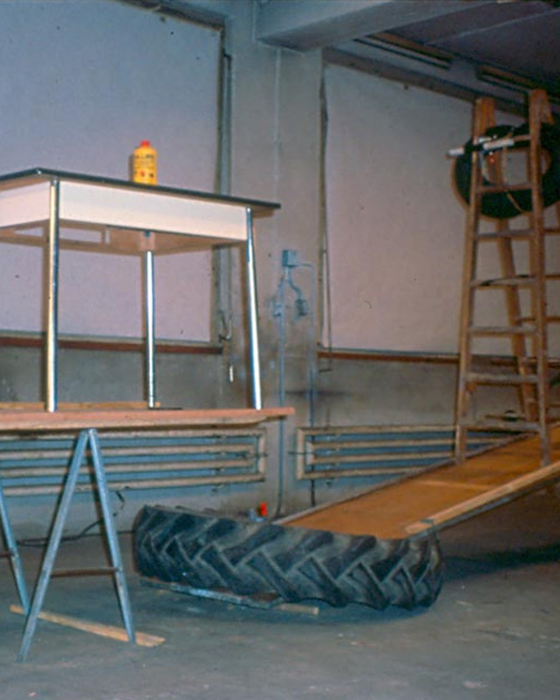 Tables and tires that are a part of the Rube Goldberg contraption filmed in "The Way Things Go."