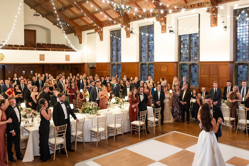 Wedding guests watching a couple take their first dance in the M&T Bank Ballroom.