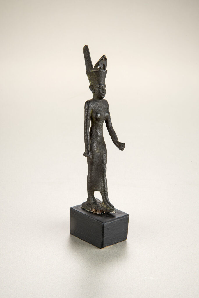 Dark bronze statue of an Egyptian goddess.