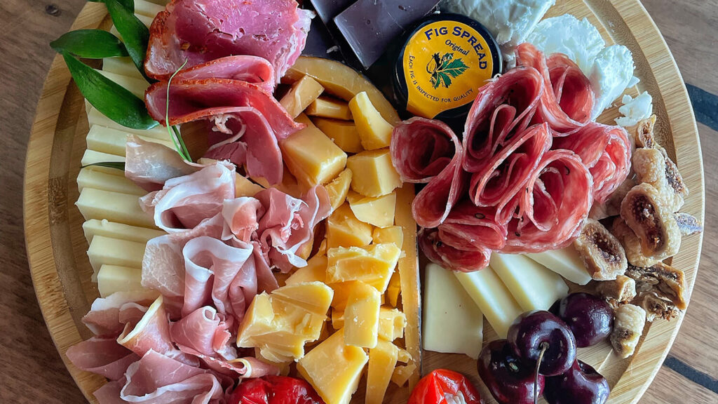 A colorful plate of charcuterie.
